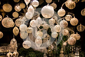 Beautiful Christmas decorations display window, elegant pearl, silver, white coloured Christmas tree balls and decors