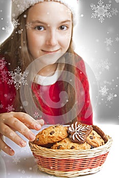 Beautiful Christmas girl wants to eat cookies