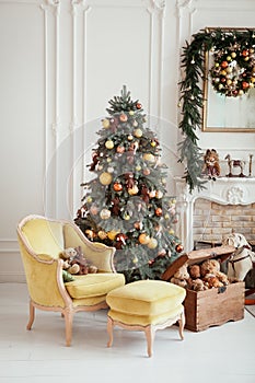 Beautiful Christmas interior. New year decoration. Living room with fireplace