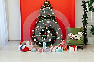 Beautiful Christmas living room with decorated Christmas tree, gifts and fireplace. The idea for postcards