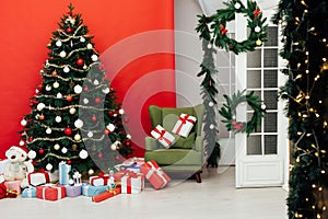 Beautiful Christmas living room with decorated Christmas tree, gifts and fireplace. The idea for postcards