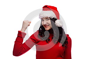Beautiful christmas santa woman showing gesture of power of success. Isolated
