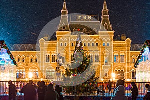 Beautiful Christmas tree on the background of GUM on Red Square