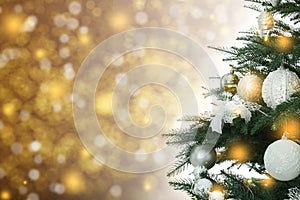 Beautiful Christmas tree with bright baubles against blurred lights on golden background, closeup. Space for text