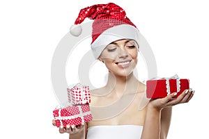 Beautiful Christmas Woman. Beauty Girl in the New Year. Model in a Santa hat