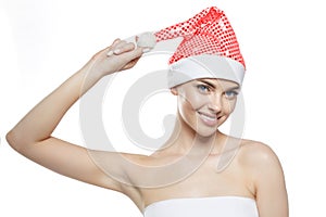 Beautiful Christmas Woman. Beauty Girl in the New Year. Model in a Santa hat