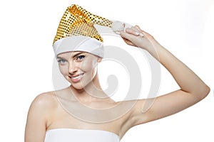 Beautiful Christmas Woman. Beauty Girl in the New Year. Model in a Santa hat