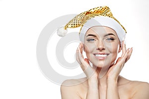 Beautiful Christmas Woman. Beauty Girl in the New Year. Model in a Santa hat