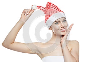 Beautiful Christmas Woman. Beauty Girl in the New Year. Model in a Santa hat