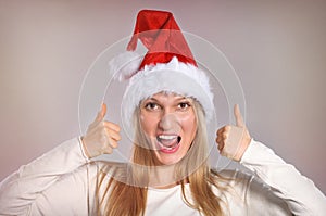 Beautiful Christmas woman with thumbs up sign