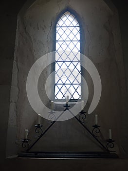 beautiful church window inside with candles space Christian
