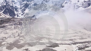 Beautiful cinematic aerial view of the icefall on the Mizhirgi Glacier