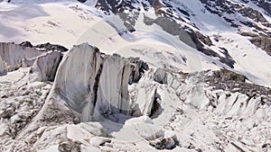 Beautiful cinematic aerial view of the icefall on the Mizhirgi Glacier