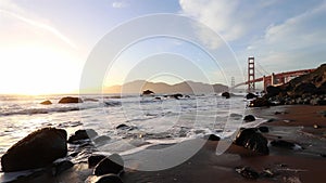 A beautiful cinematic footage of Golden Gate Bridge during the sunset time. Golden hour at San Francisco in California