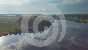 A beautiful cinematic frame of nature. A picture of a small river among fields