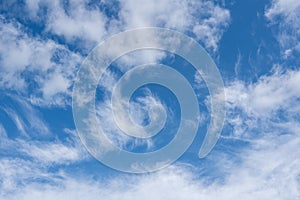 Beautiful cirrus clouds in the blue morning sky. Background of blue sky and white cirrus clouds