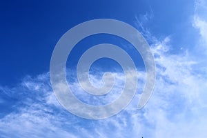 Beautiful cirrus clouds in natural cloud formations in a deep blue sky