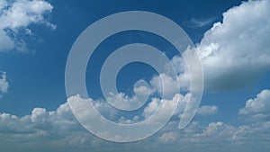 Beautiful cirrus and cumulus on different layers cloud formations in a deep blue sky. Soft cirrus couds on blue sky