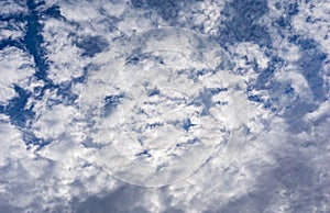 Beautiful cirrus fluffy clouds on a blue sky background