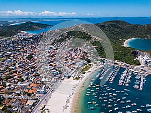 Beautiful city Arraial do Cabo Brazil. Praia dos Anjos. Aerial drone photo from above. Mountains ocean and fishing boats