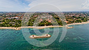 Beautiful city beach of Sanur. Aerial view, Bali, Indonesia.