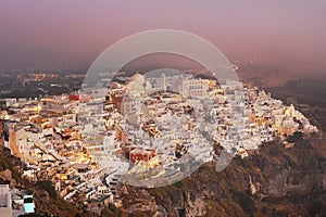 The beautiful city of Fira in Santorini/Greece during golden sunset.