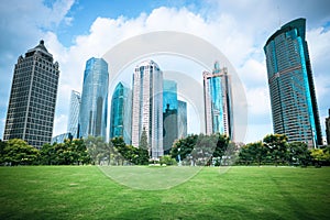 Beautiful city greenbelt with modern buildings photo