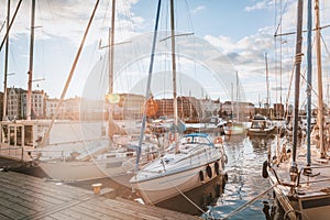 A beautiful city landscape, a port with boats in the rays of the