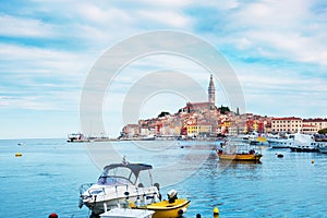 Beautiful city landscape with sea boats, colorful houses and an ancient tower in Rovinj, Croatia, Europe. vacation, rest -