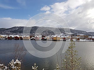 The beautiful city of MosjÃÂ¸en in Northern Norway with the river Vefsn river