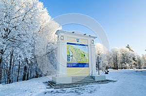 Beautiful city park with trees covered with hoarfrost