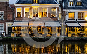 Beautiful city scenery at night with lighted buildings and the water reflecting the lights, Popular dutch city Alphen aan den Rijn