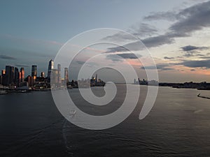 Beautiful cityscape of midtown Manhattan over the Hudson River during sunset