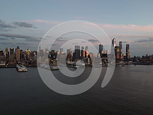 Beautiful cityscape of midtown Manhattan over the Hudson River during sunset