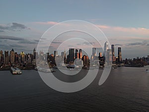 Beautiful cityscape of midtown Manhattan over the Hudson River during sunset