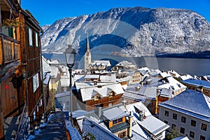 beautiful cityscape of the special city Hallstatt in Austria Salzkammergut snowy winter mountains and lake and church