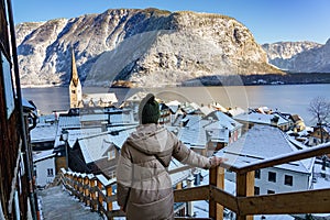 beautiful cityscape of the special city Hallstatt in Austria Salzkammergut snowy winter mountains and lake with tourist