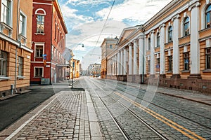 Beautiful cityscape, street in the center of Helsinki, the capital of Finland. Street with paving stones and tram ways. Popular d