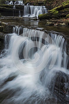 Beautiful claming landscape image of Scaleber Force waterfall in Yorkshire Dales in England during Winter morning