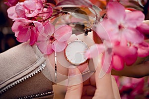 Beautiful classic stylish white watch on woman hand. Close-up photo
