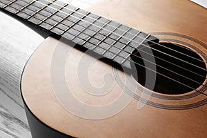 Beautiful classical guitar, view on body with strings.