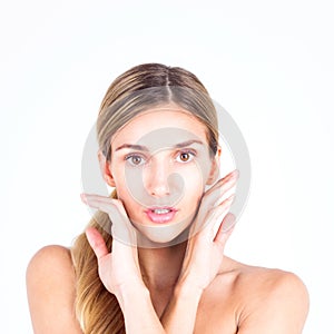 Beautiful and clean face of woman. Beautiful woman touching her face with both hands