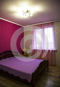 Beautiful clean and modern bedroom. Double bed. Bedroom in lilac tones