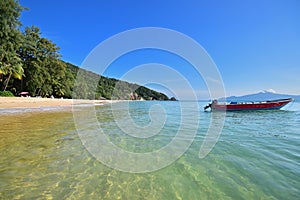 Beautiful clear transparent water with brown fine sand of Pulau Sibu island, Mersing District, Johor, Malaysia