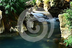 Beautiful Clear water flowing in the Lake or river and environment in front of Tham Chang cave Vangvieng , Laos