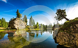 Beautiful clear water lake in the early morning in the Dolomites