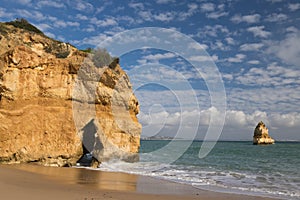 beautiful cliffs of camilo beach in south portugal