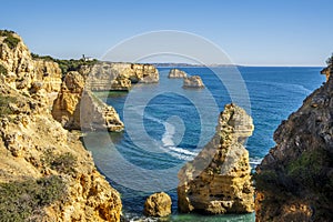 Beautiful cliffs and rock formations at Marinha Beach in Algarve, Portugal