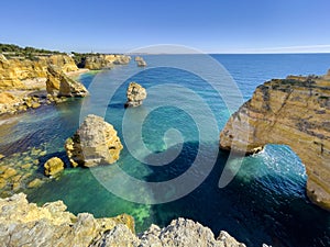 Beautiful cliffs and rock formations at Marinha Beach in Algarve, Portugal