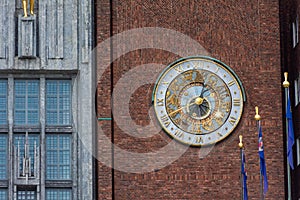 Beautiful clock on the external wall of the Oslo town hall,  Norway